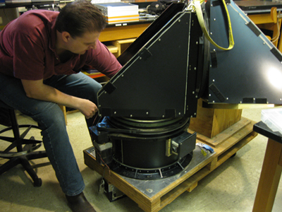 Chris Van Hoosear working on the beam steering unit.